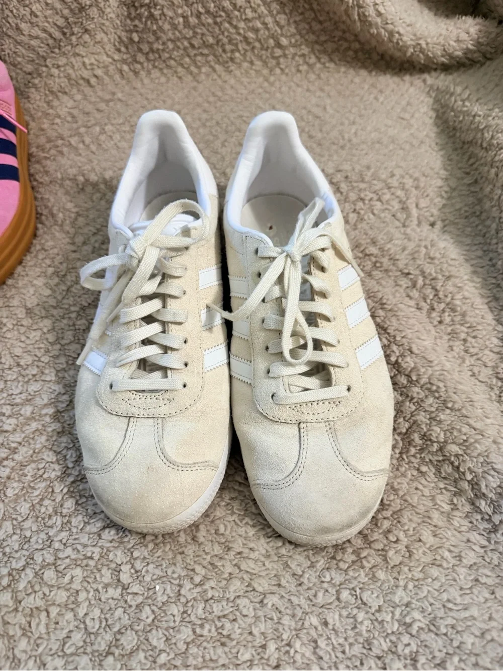 Women’s Adidas Gazelle sneakers in white/cream suede.